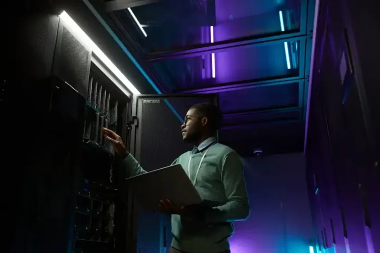 Network engineer inspecting a server rack